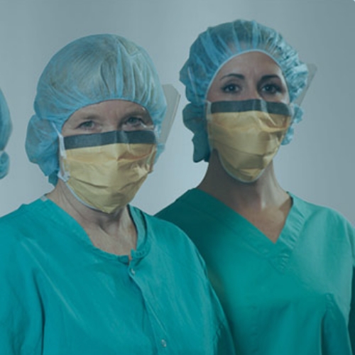 Advanced periop nurses wearing masks and scrubs.