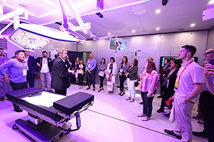 A group of AORN Expo attendees take a private tour of an exhibit booth