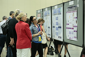 AORN Expo Attendees discuss an educational poster