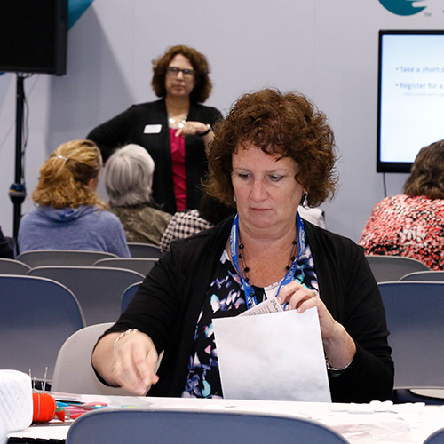 aorn-discovery_500x500 Two people talking in the Expo Hall at AORN Surgical Expo.
