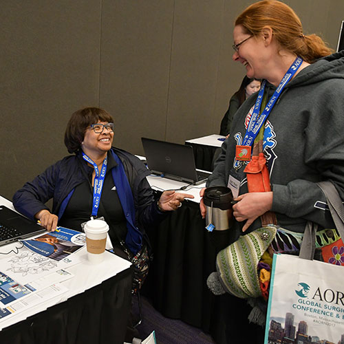 Career-Center_500x500 Two people talking in the Expo Hall at AORN Surgical Expo.