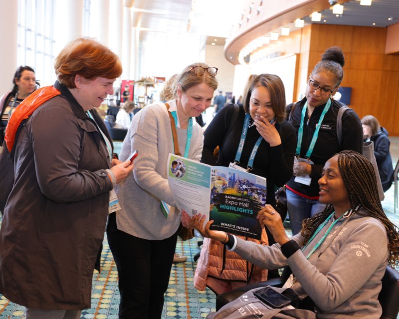 Expo attendees look at schedule