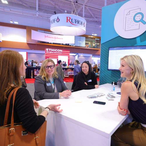 people sitting in AORN booth