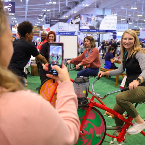 woman taking photo of woman on bike